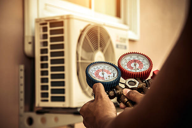 Professional Air Conditioning Service technician working in North Pembroke, MA
